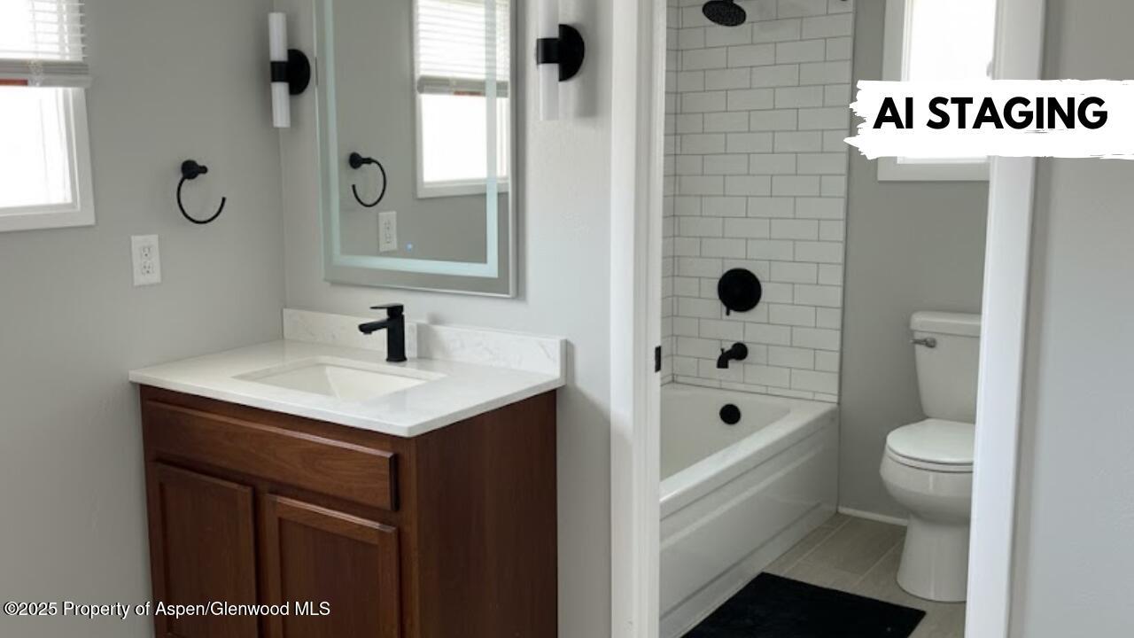 420 West 16th Street Rifle, CO 81650 - Photo 24 of 37 a bathroom with a sink a toilet and shower