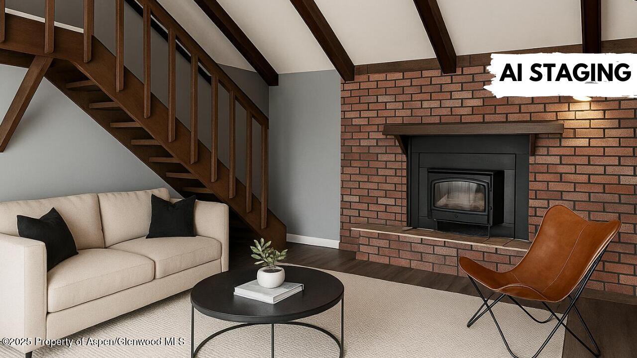 420 West 16th Street Rifle, CO 81650 - Photo 7 of 37 a living room with furniture and a fireplace