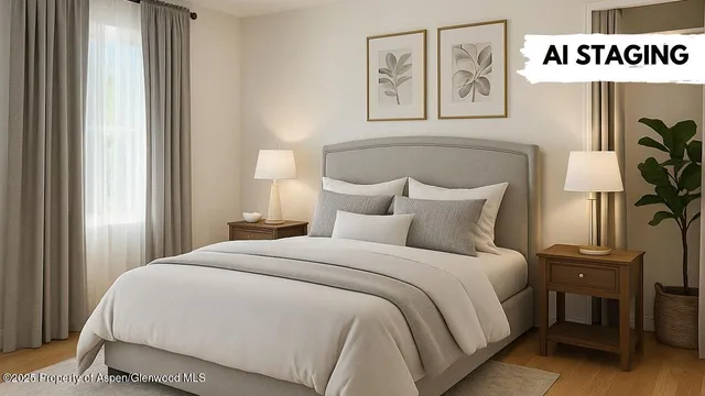 a bedroom with a bed and painting on the wall