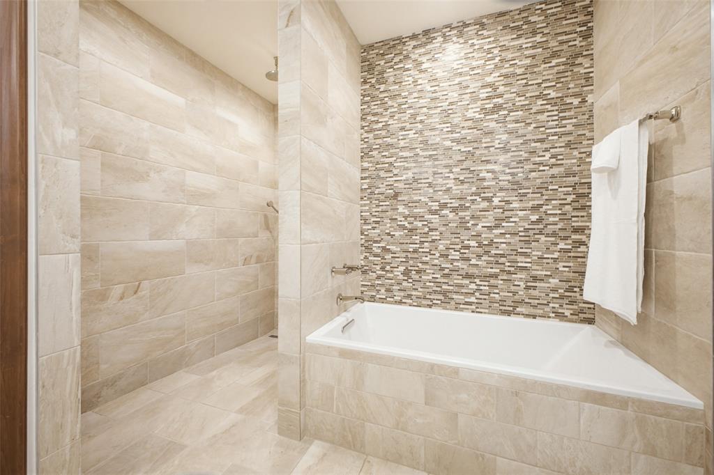 6622 Norway Road Dallas, TX 75230 - Photo 20 of 40 a bathroom with a bathtub and shower