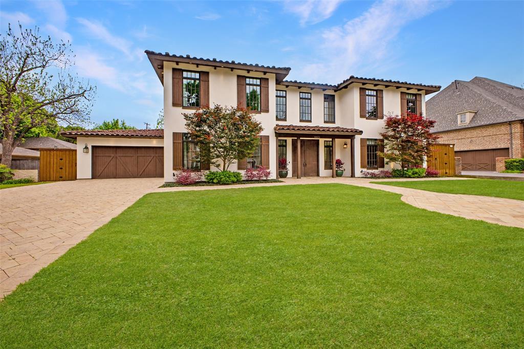 6622 Norway Road Dallas, TX 75230 - Photo 2 of 40 a front view of a house with a garden and yard