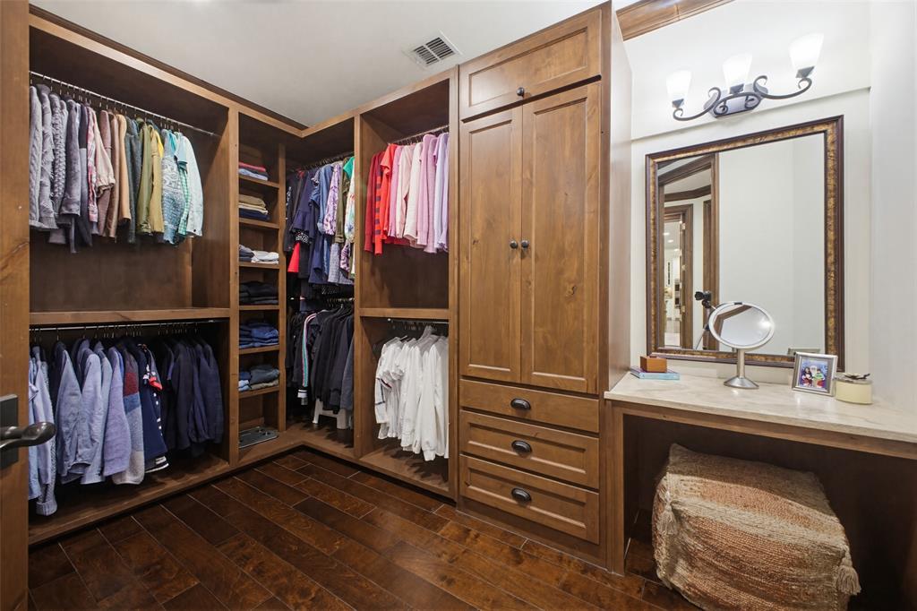 6622 Norway Road Dallas, TX 75230 - Photo 21 of 40 a bathroom with a sink a mirror and a shower