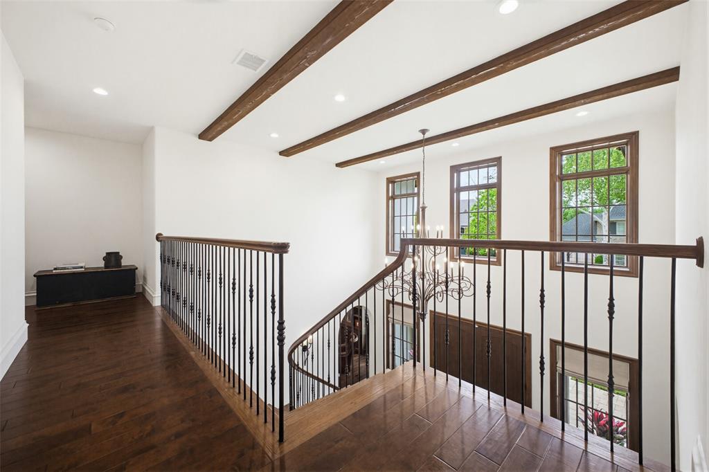 6622 Norway Road Dallas, TX 75230 - Photo 22 of 40 a view of a hallway with wooden floor and stairs