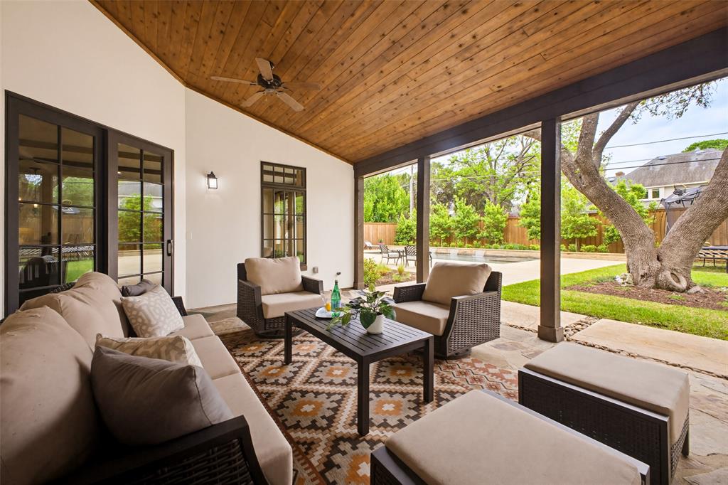 6622 Norway Road Dallas, TX 75230 - Photo 30 of 40 a living room with furniture and a garden