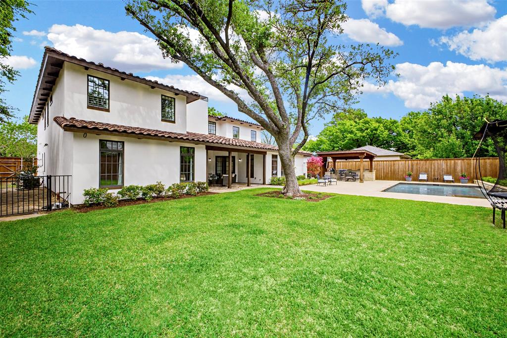 6622 Norway Road Dallas, TX 75230 - Photo 38 of 40 a view of a house with backyard and a tree