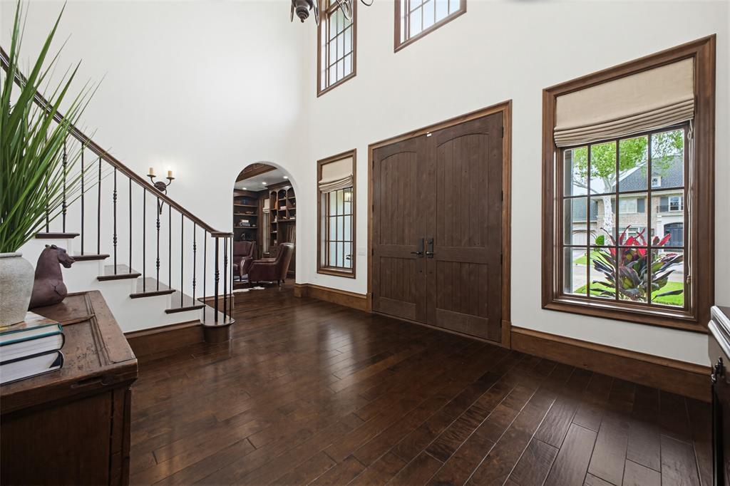 6622 Norway Road Dallas, TX 75230 - Photo 5 of 40 a view of a hallway with wooden floor and windows