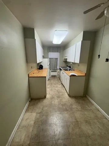 a bathroom with a sink and a washing machine