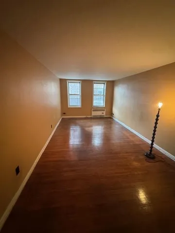 a view of a brick house with many windows