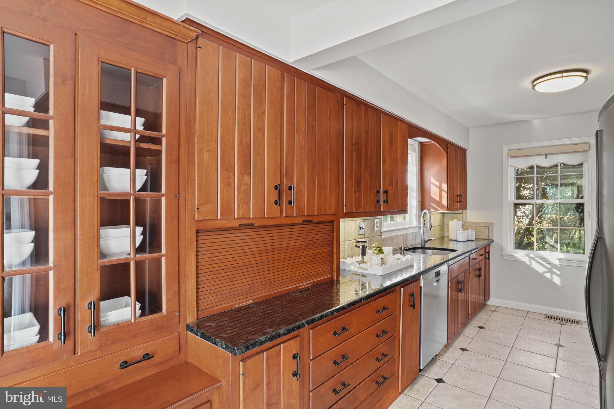 406 West Braddock Road Alexandria, VA 22302 - Photo 12 of 56 Custom original wood cabinetry with glass doors