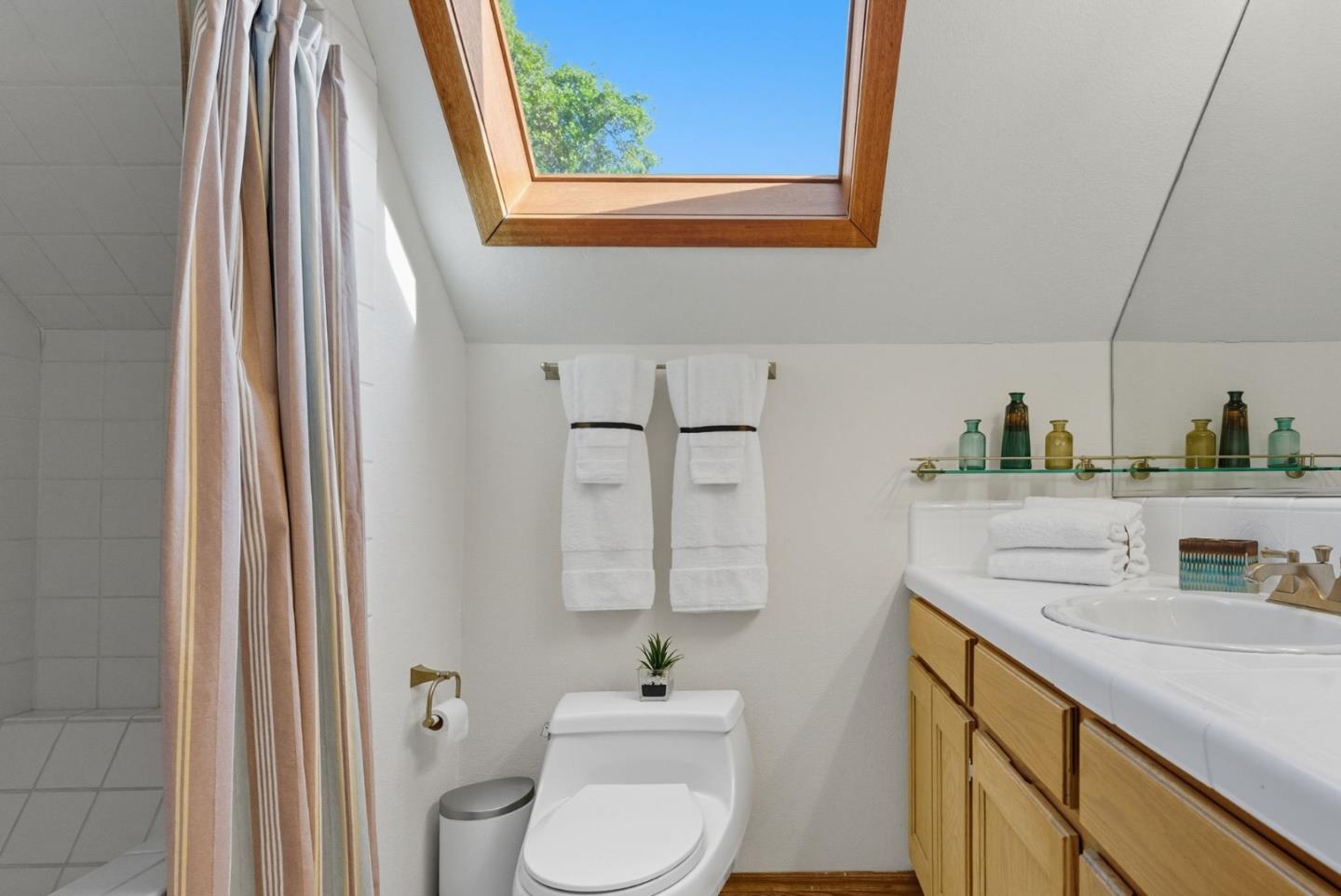 600 Nicasio Way Soquel, CA 95073 - Photo 30 of 47 a bathroom with a sink a toilet and a window