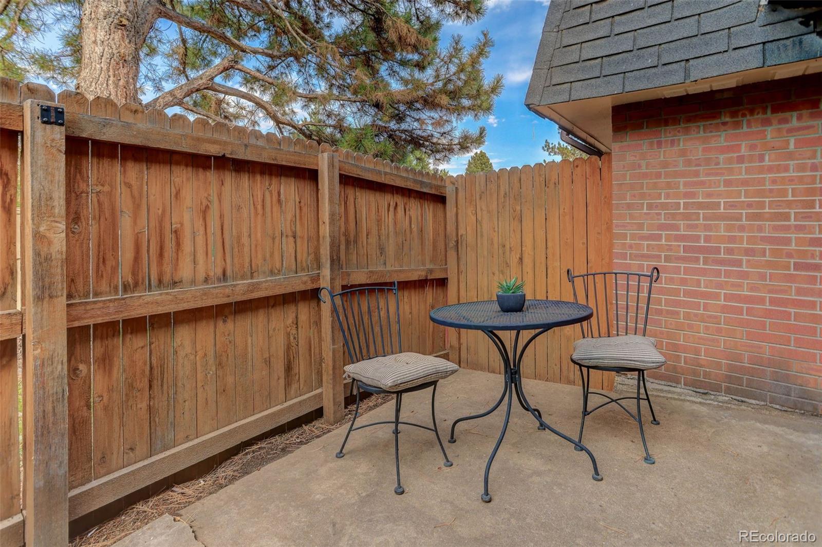 5846 South Pearl Street Centennial, CO 80121 - Photo 11 of 32 a backyard of a house with table and chairs