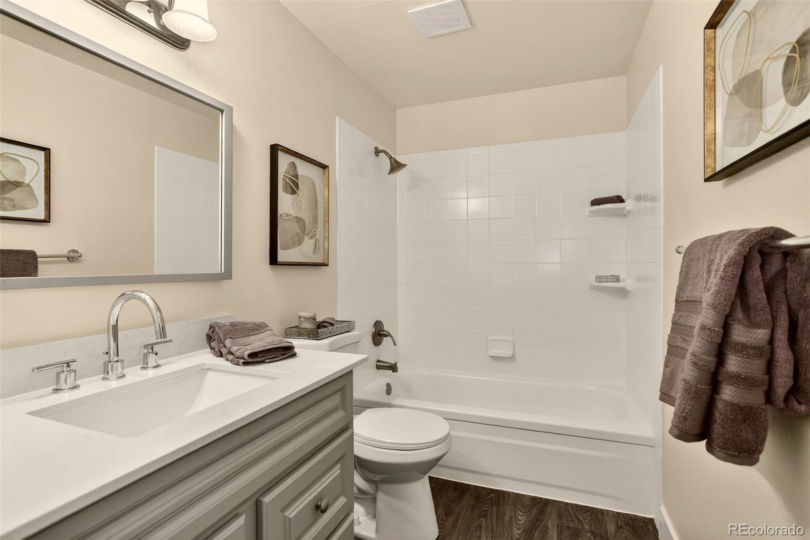5846 South Pearl Street Centennial, CO 80121 - Photo 12 of 32 a bathroom with a sink toilet and shower