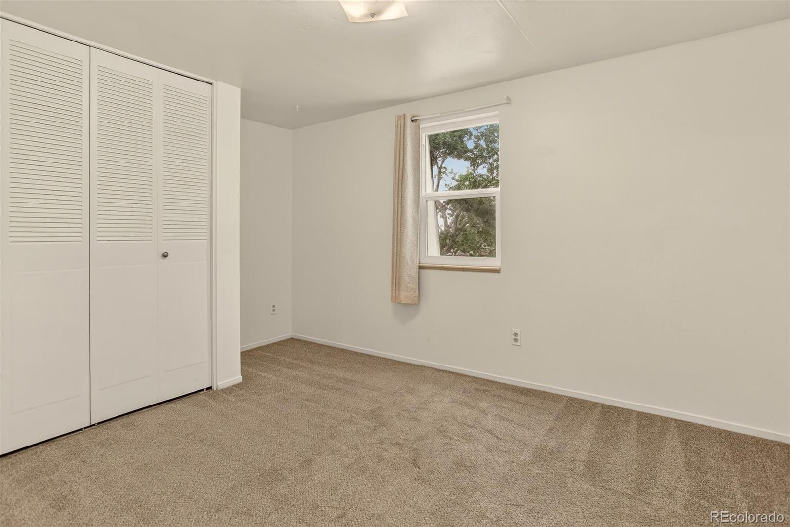 5846 South Pearl Street Centennial, CO 80121 - Photo 13 of 32 an empty room with windows