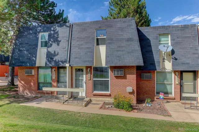 a bedroom with bed and a window