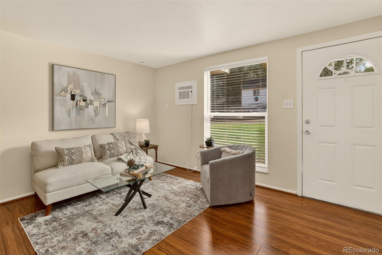 5846 South Pearl Street Centennial, CO 80121 - Photo 2 of 32 a living room with furniture and a window
