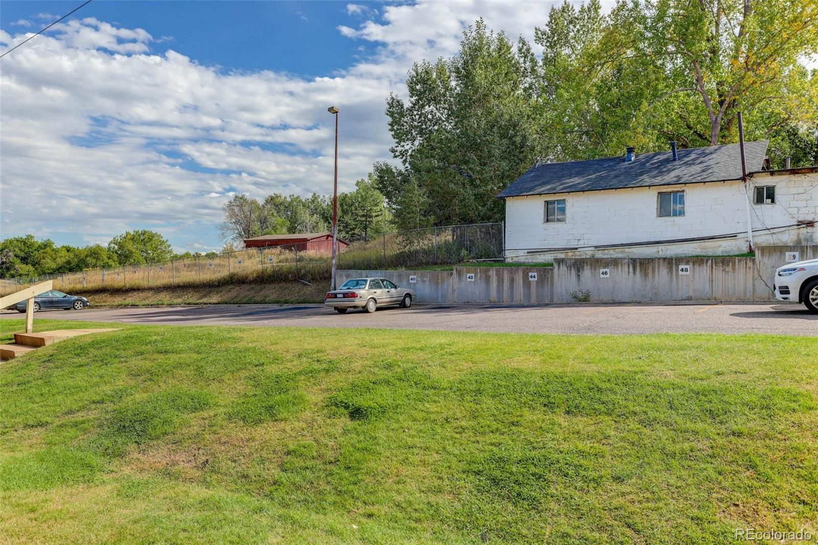 5846 South Pearl Street Centennial, CO 80121 - Photo 26 of 32 a view of a house with a big yard