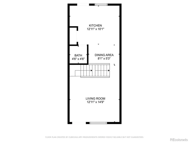 a picture of a bench in front of a wall