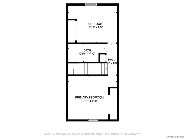 a picture of a bench in front of a wall