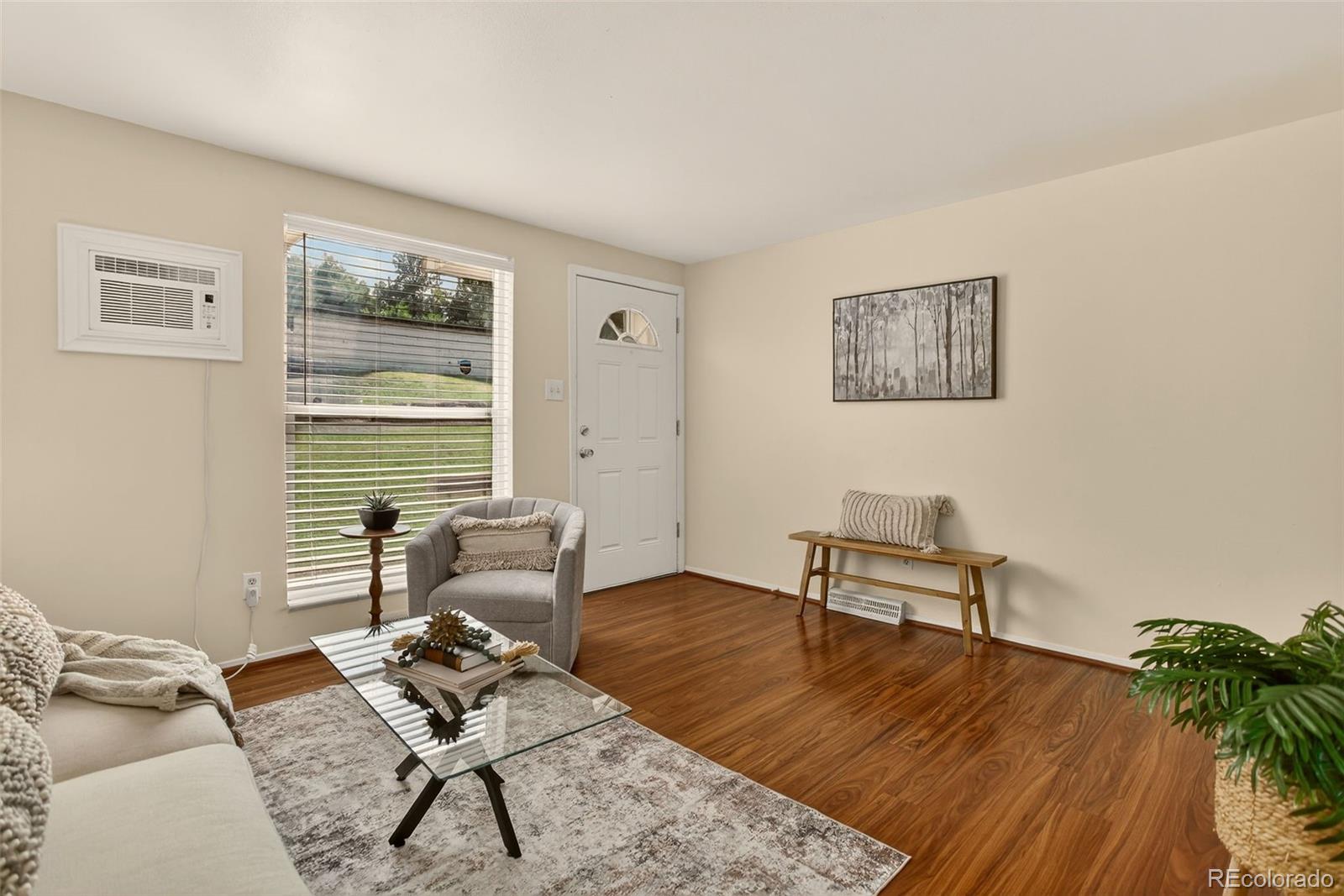 5846 South Pearl Street Centennial, CO 80121 - Photo 4 of 32 a living room with furniture and wooden floor
