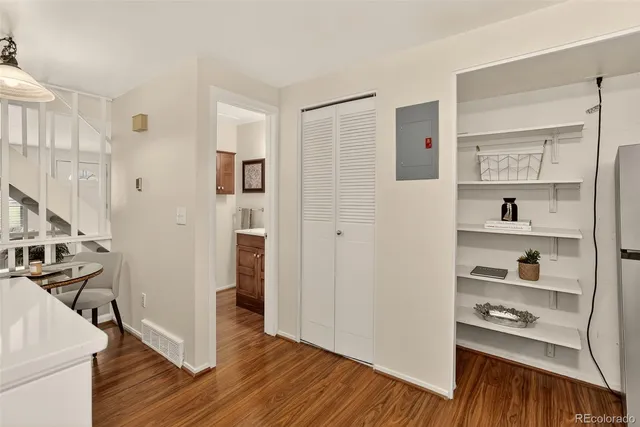a view of livingroom with hardwood and front door