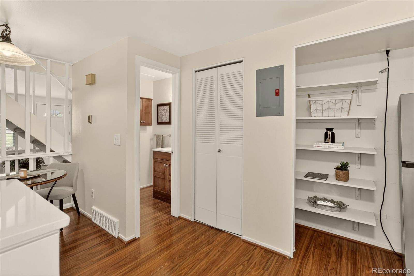 5846 South Pearl Street Centennial, CO 80121 - Photo 9 of 32 a view of livingroom with hardwood and front door