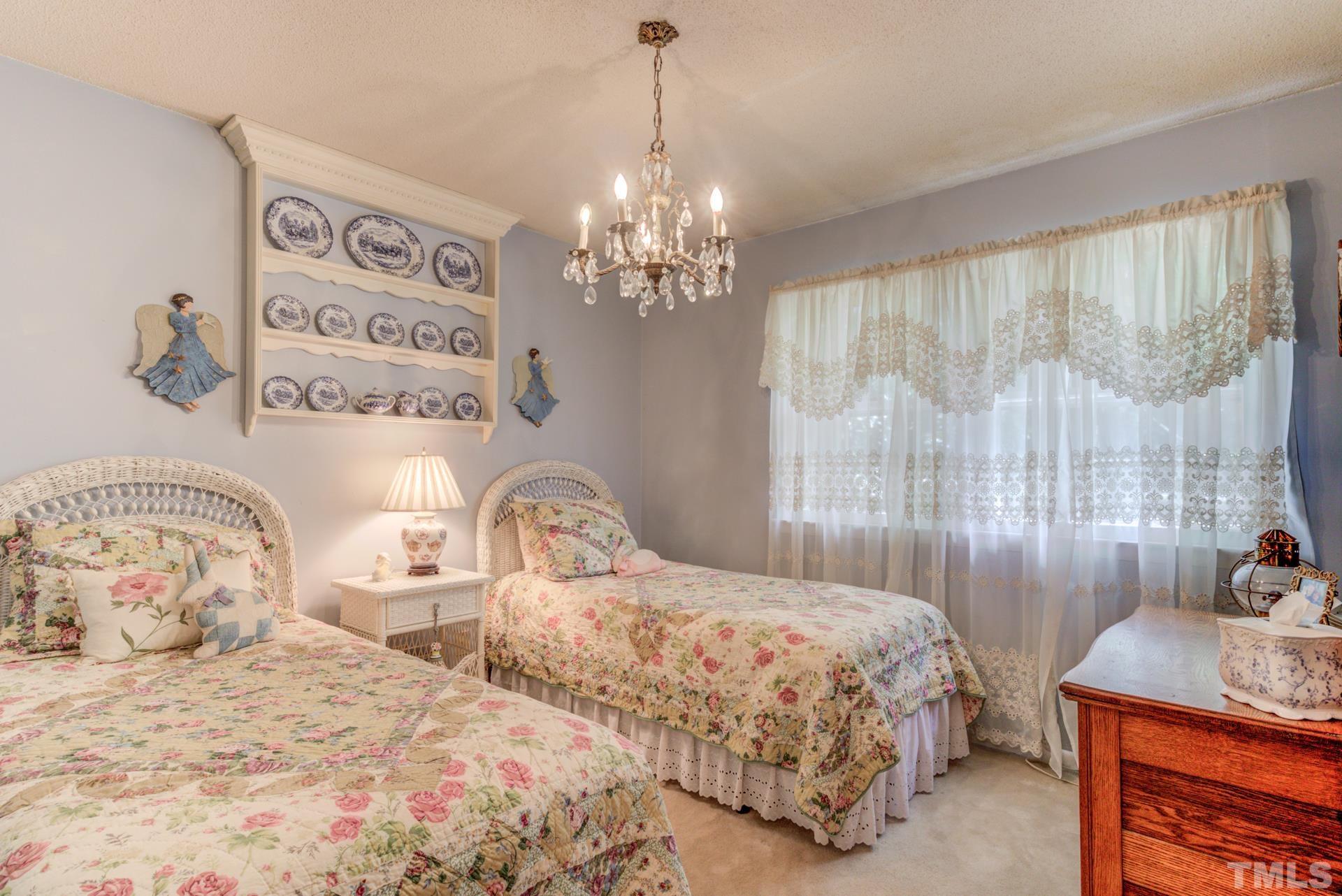 2308 Vandora Springs Road Raleigh, NC 27603 - Photo 22 of 22 a bedroom with a bed and a window