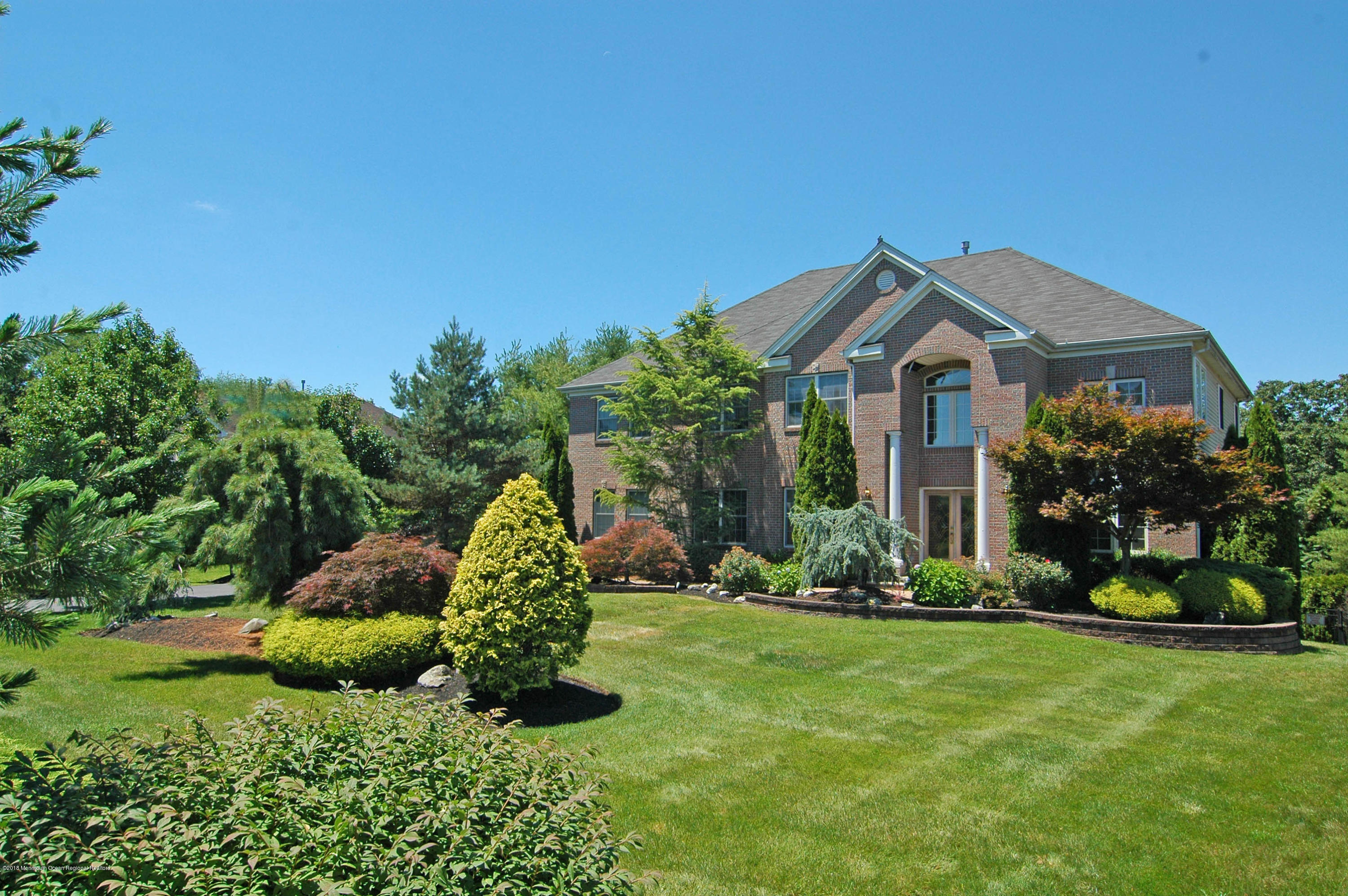 76 Mill Pond Road Jackson, NJ 08527 - Photo 1 of 23 a front view of a house with a yard