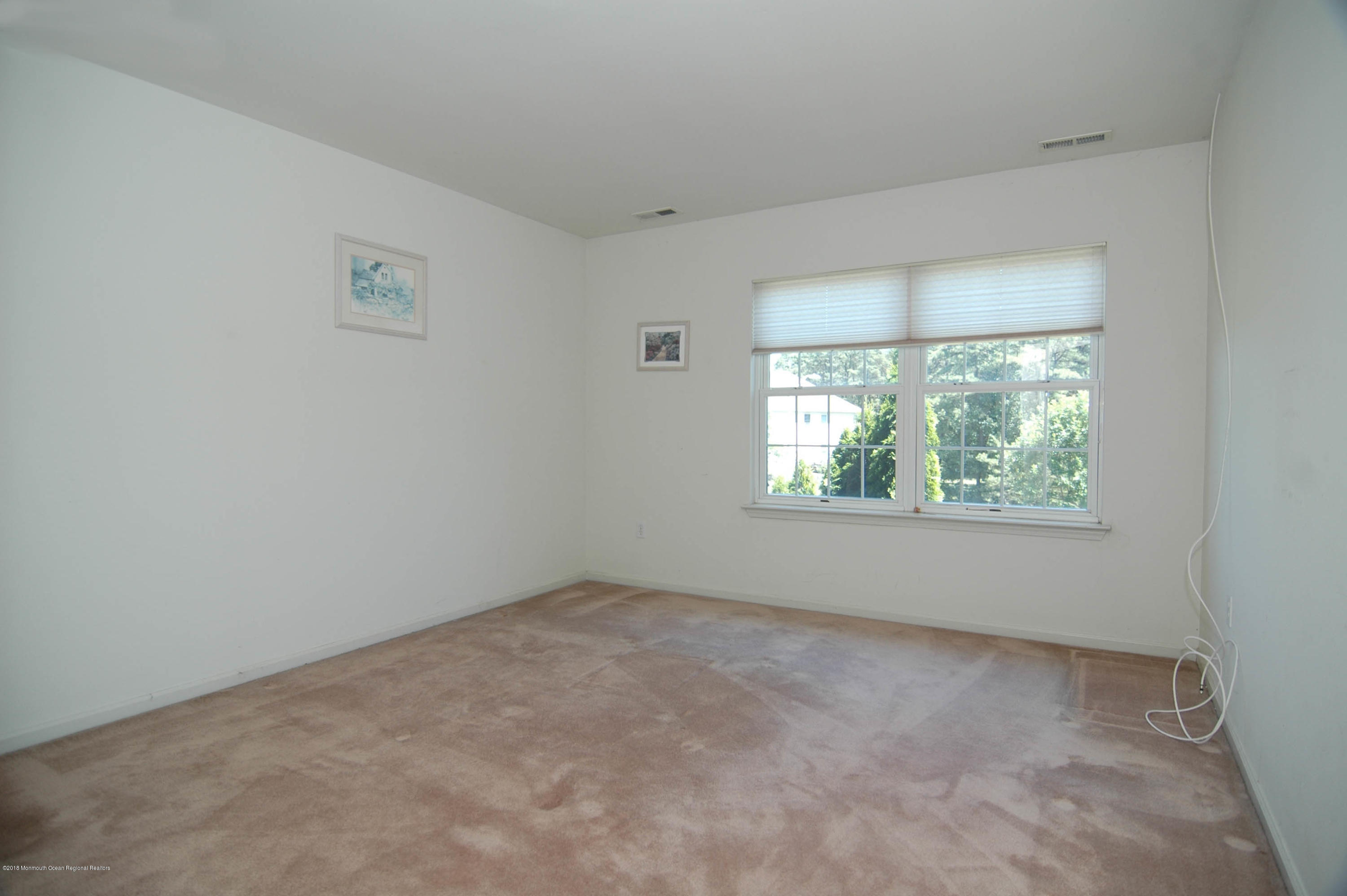 76 Mill Pond Road Jackson, NJ 08527 - Photo 13 of 23 an empty room with a window
