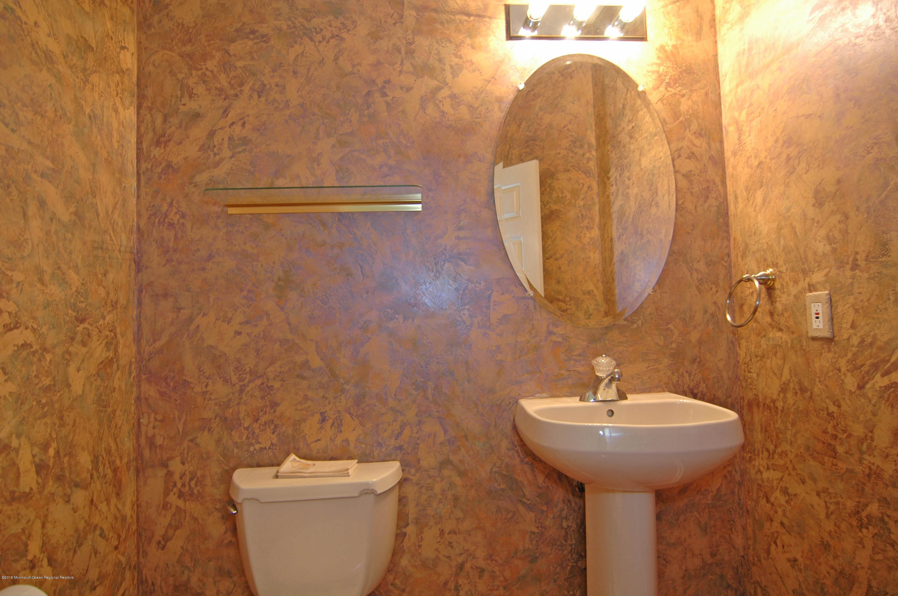 76 Mill Pond Road Jackson, NJ 08527 - Photo 17 of 23 a bathroom with a sink and mirror