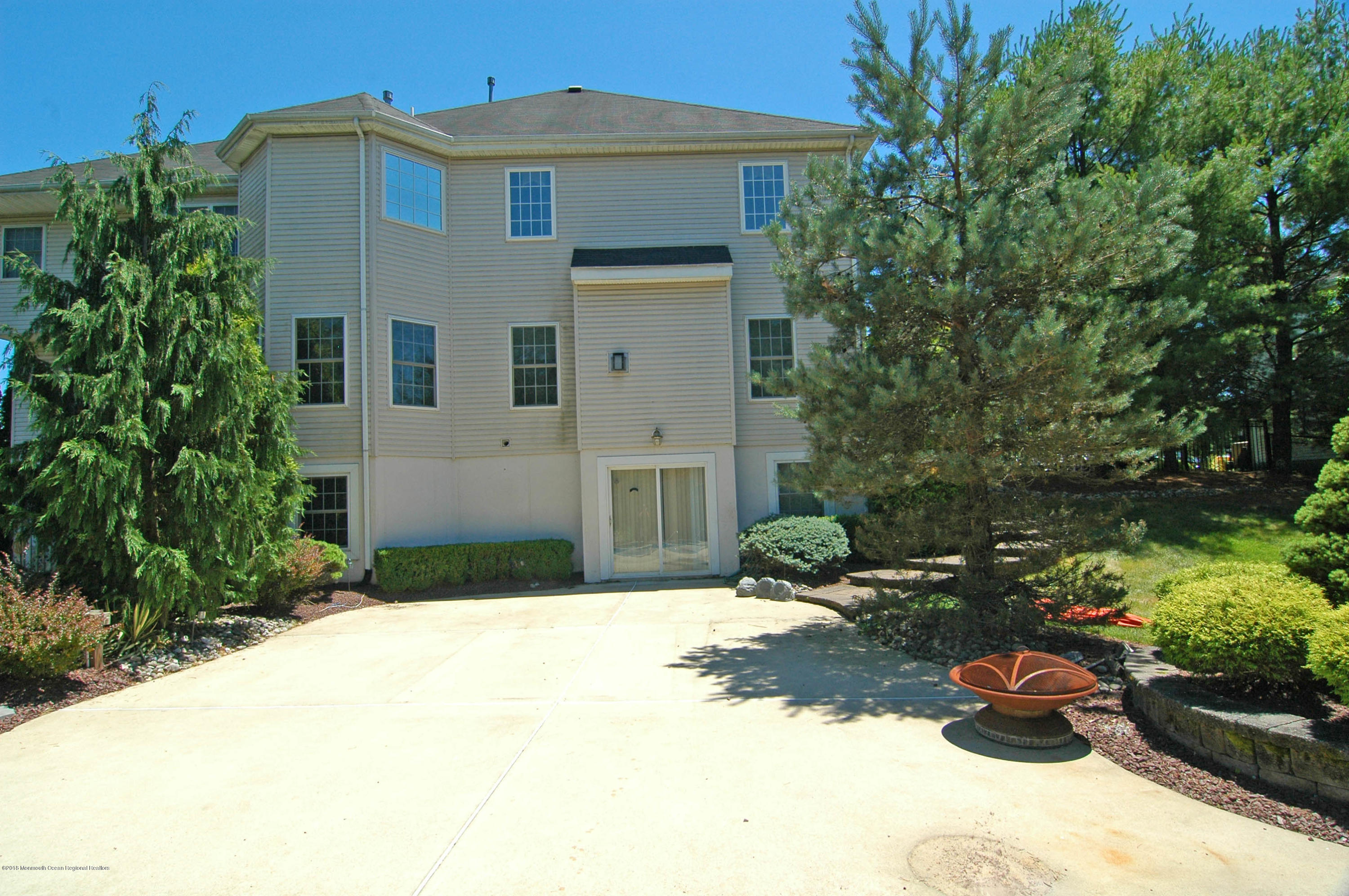 76 Mill Pond Road Jackson, NJ 08527 - Photo 20 of 23 a front view of a house with a yard