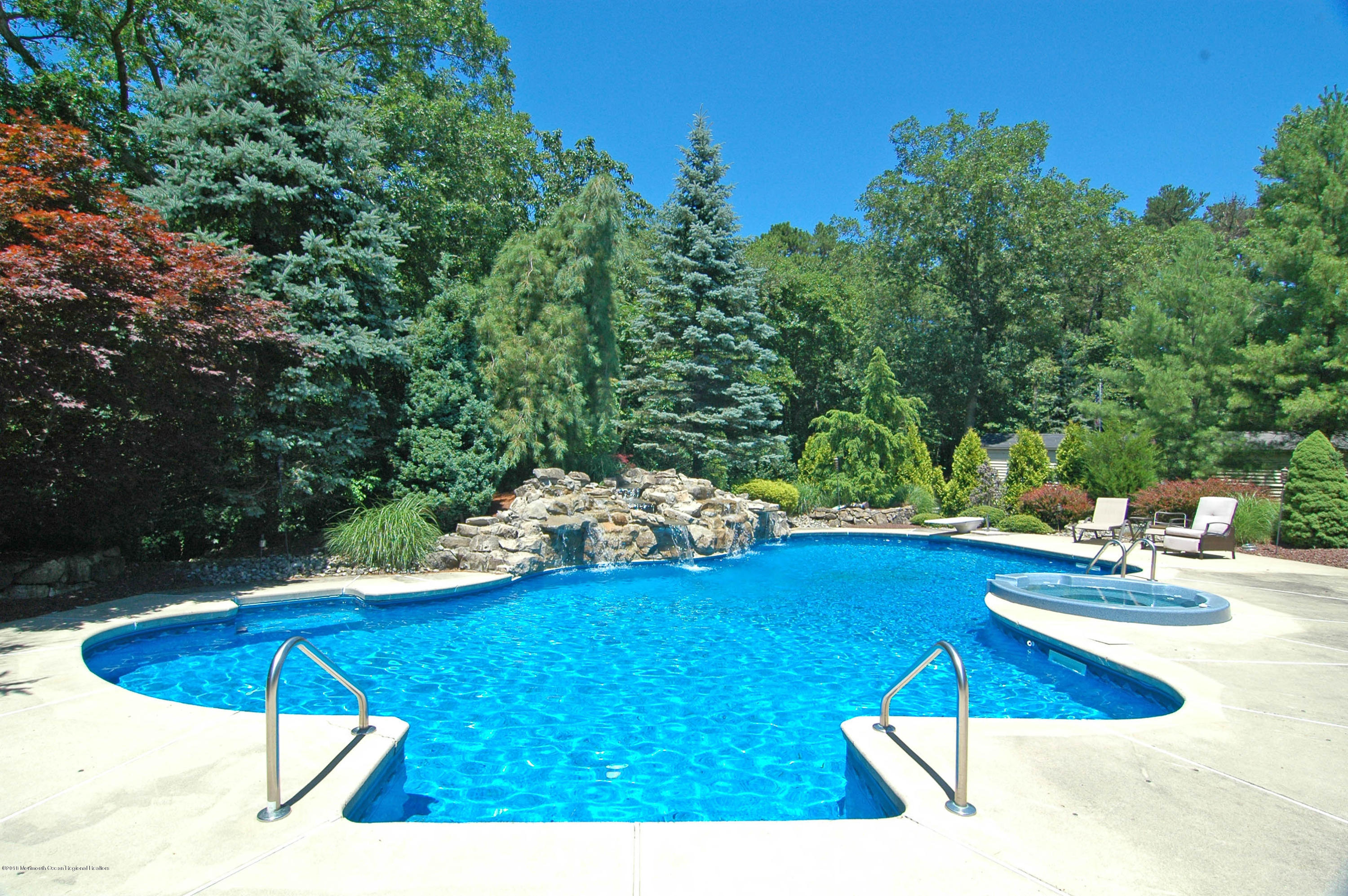 76 Mill Pond Road Jackson, NJ 08527 - Photo 21 of 23 a view of a swimming pool with an outdoor space