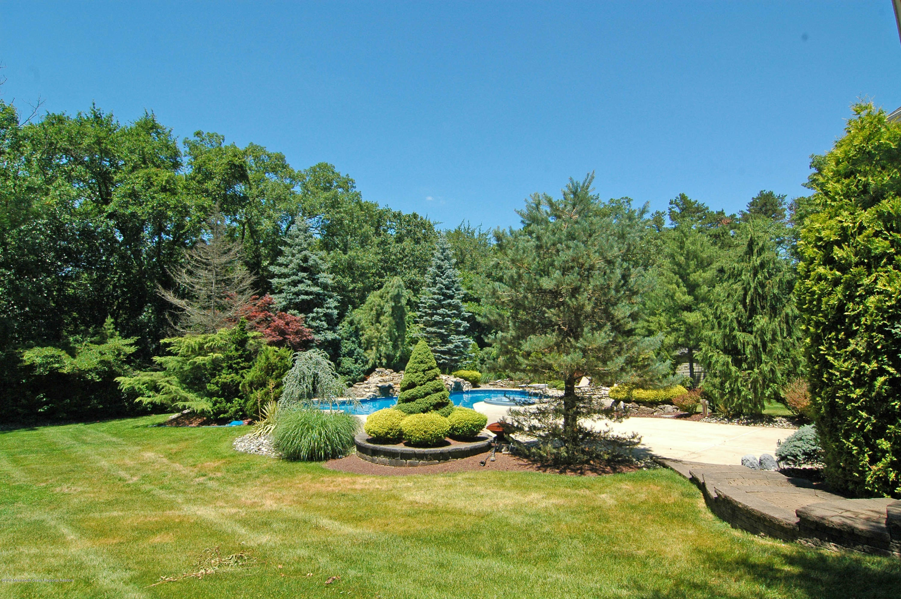 76 Mill Pond Road Jackson, NJ 08527 - Photo 23 of 23 a view of a lake with a house