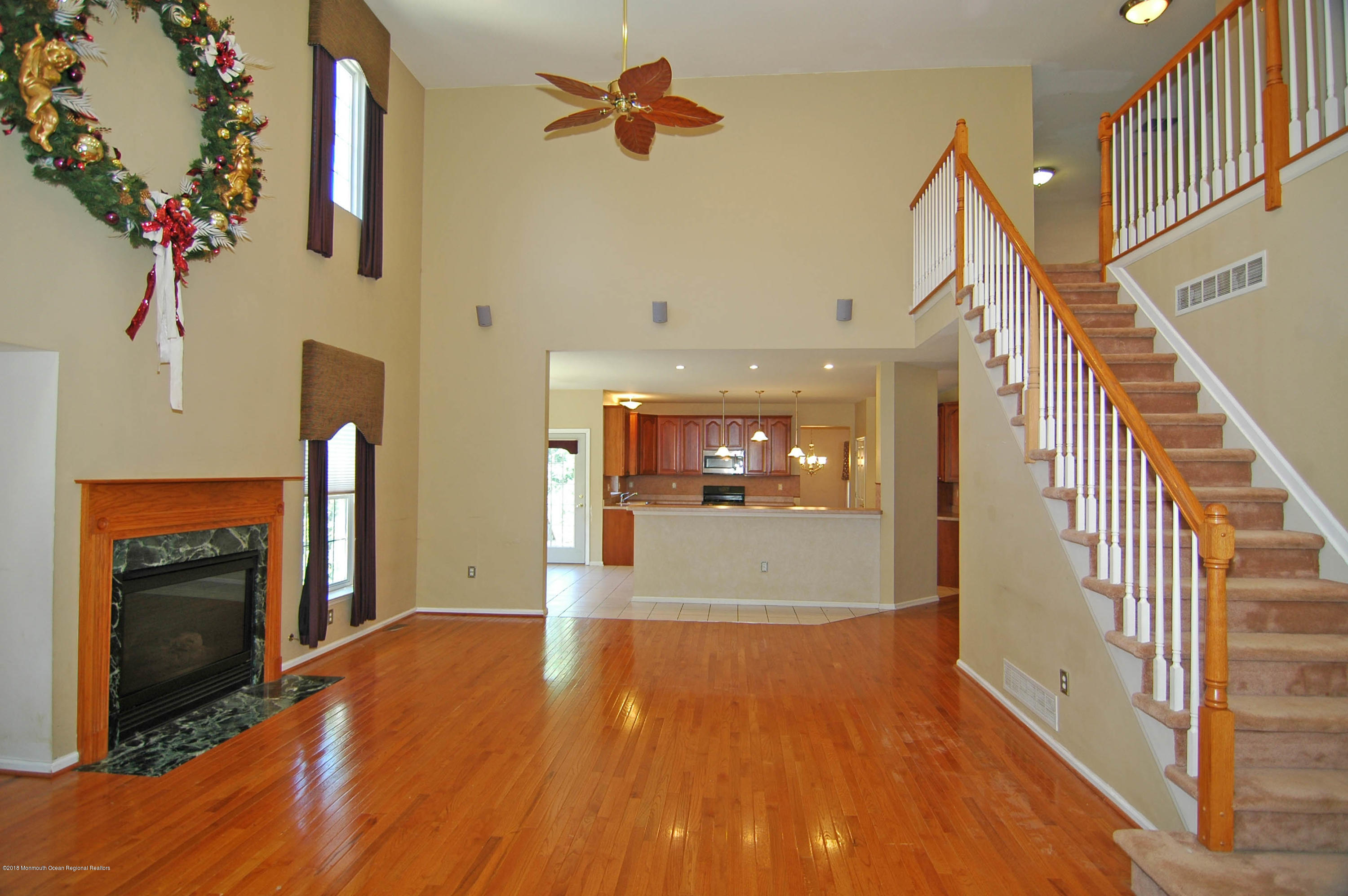 76 Mill Pond Road Jackson, NJ 08527 - Photo 8 of 23 a view of a hallway view with wooden floor and staircase