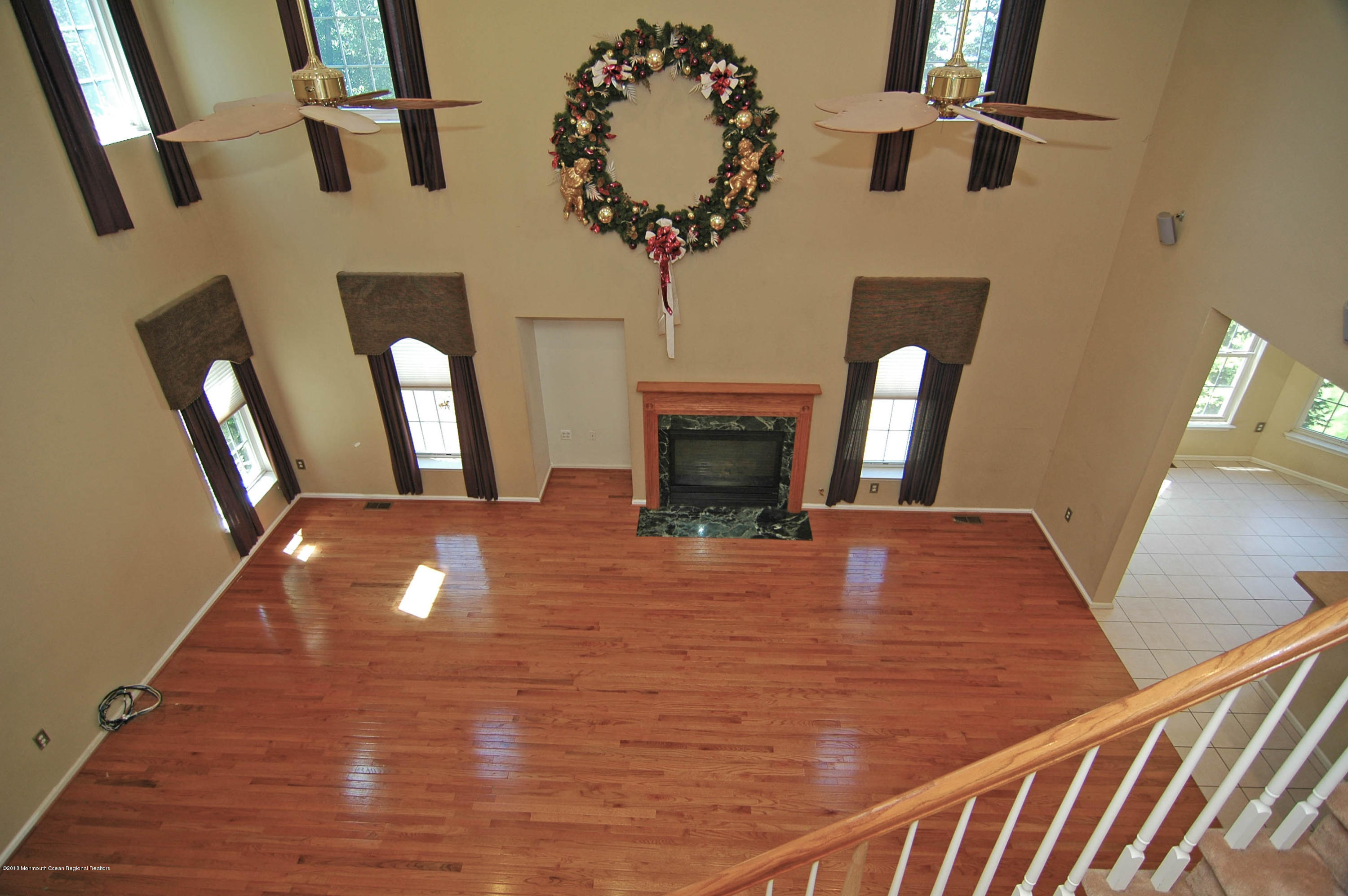 76 Mill Pond Road Jackson, NJ 08527 - Photo 9 of 23 a view of a livingroom with furniture wooden floor and a chandelier