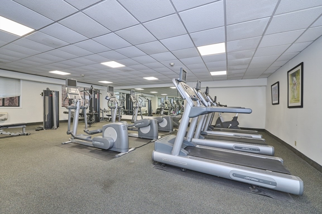 1500 Worcester Road, Unit 612 Framingham, MA 01702 - Photo 15 of 17 a view of a livingroom with furniture and a projector