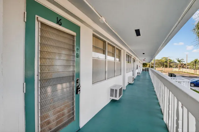 a view of a swimming pool with a yard