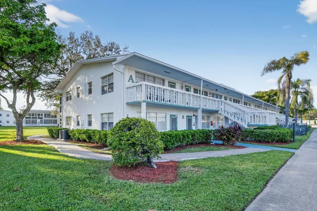 a view of a shop with tables and chairs