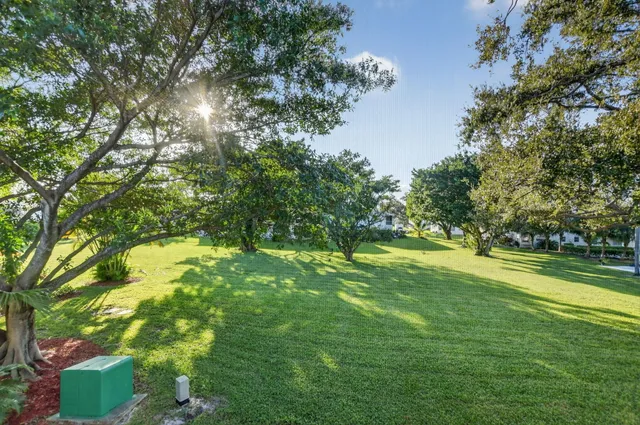 an aerial view of a house with garden space and street view