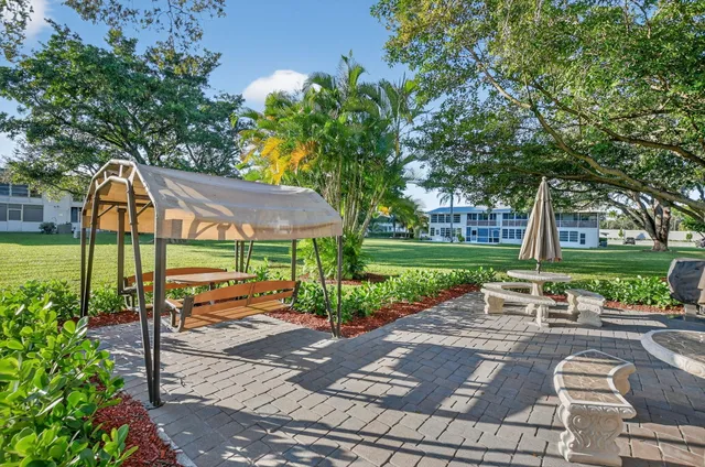 an aerial view of residential houses with outdoor space and river