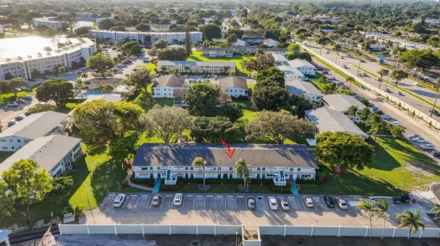 an aerial view of a house with a swimming pool