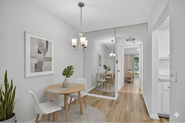 a bedroom with a bed and a potted plant