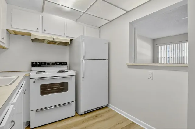 a view of a porch with wooden floor and stairs