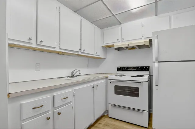 a yard with swimming pool and green space