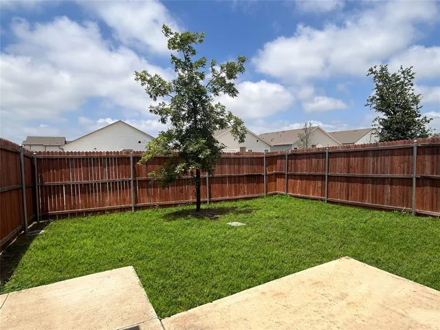 a view of a backyard with a garden