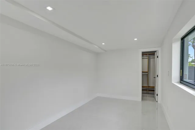 an aerial view of multiple houses with yard