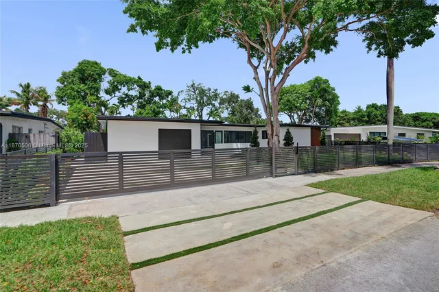 a kitchen with stainless steel appliances a refrigerator sink and stove