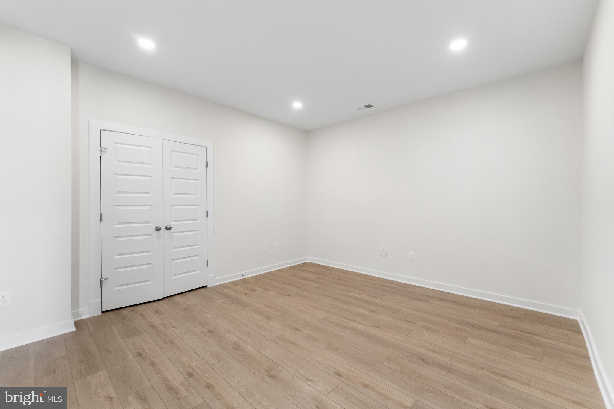 113 Summit Point Boulevard, Unit 19J Bowie, MD 20716 - Photo 21 of 38 wooden floor in an empty room