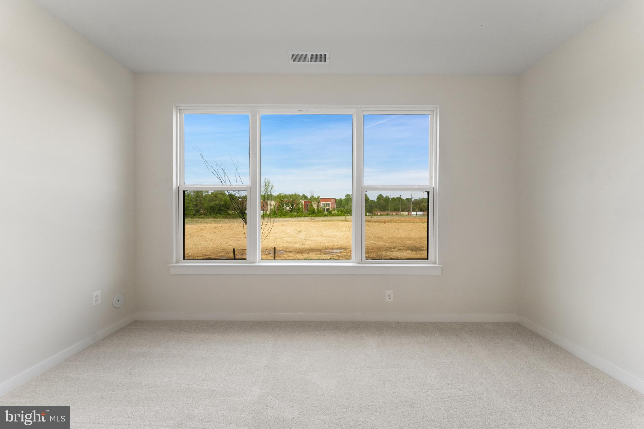 113 Summit Point Boulevard, Unit 19J Bowie, MD 20716 - Photo 24 of 38 an empty room with a window