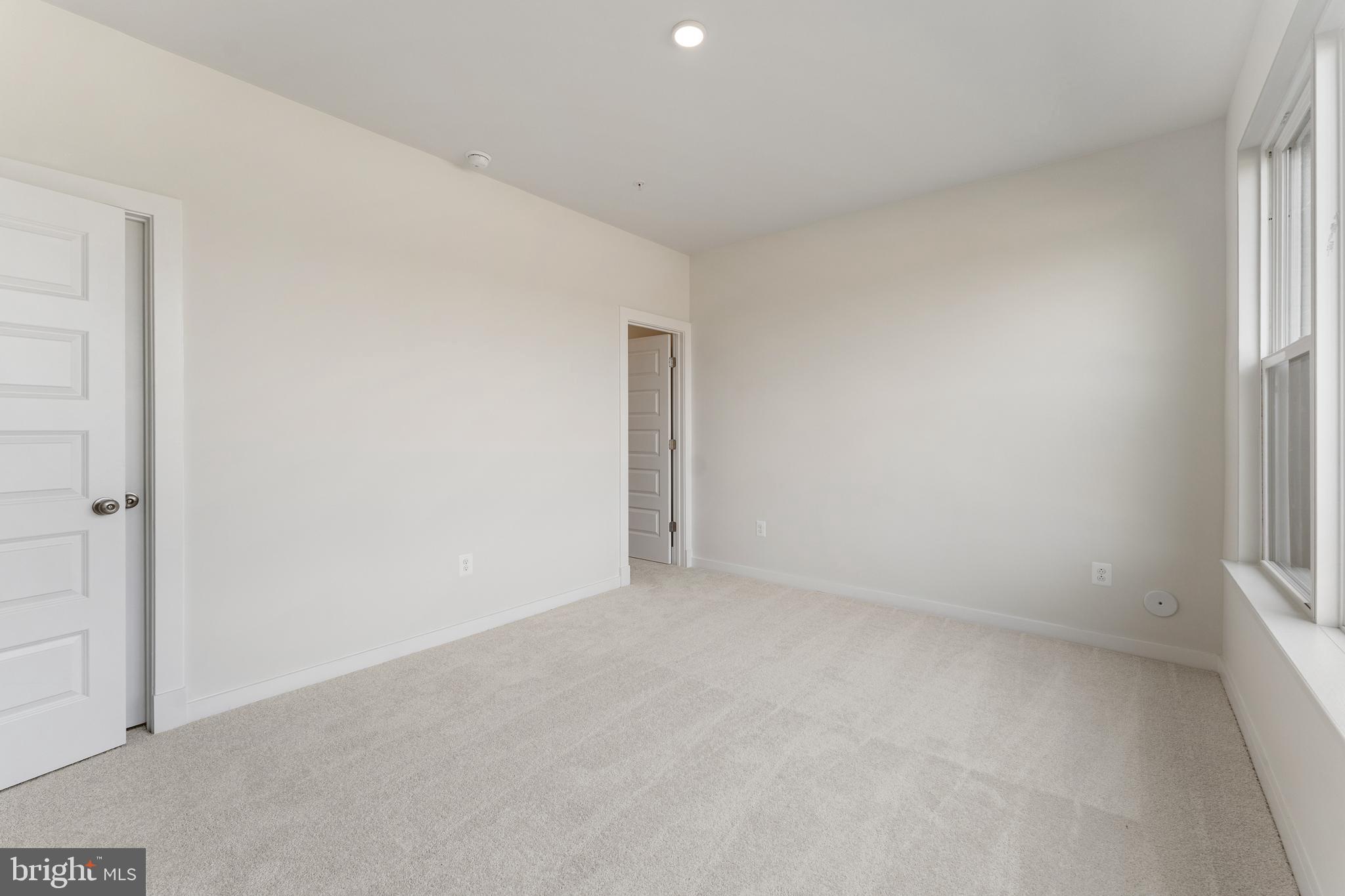 113 Summit Point Boulevard, Unit 19J Bowie, MD 20716 - Photo 25 of 38 an empty room with a window