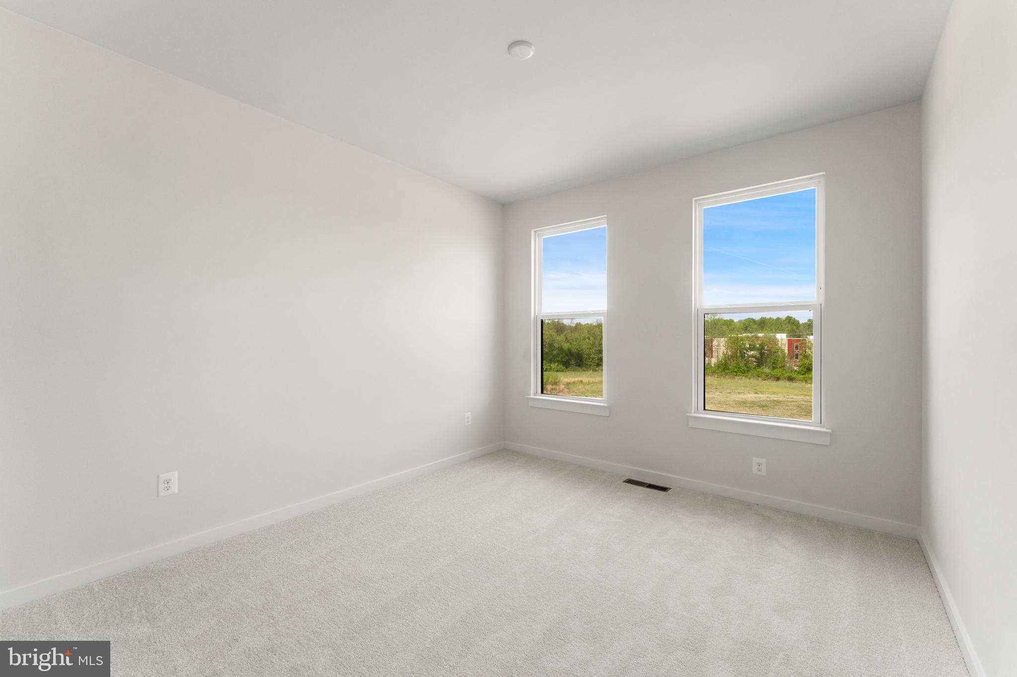 113 Summit Point Boulevard, Unit 19J Bowie, MD 20716 - Photo 31 of 38 an empty room with windows